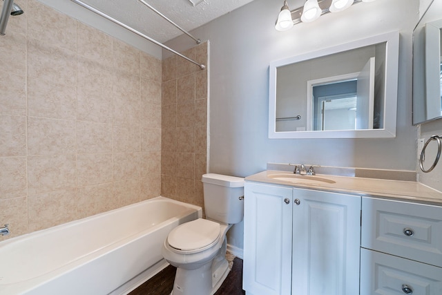 1502 Stevenage Ln, Channelview, TX 77530 - bathroom with toilet,  shower combination, vanity, and a textured ceiling