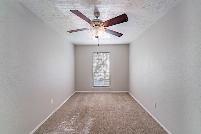 1502 Stevenage Ln, Channelview, TX 77530 - spare room with carpet flooring, a textured ceiling, a ceiling fan, a textured wall, and baseboards