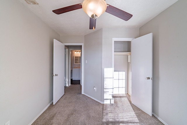 1502 Stevenage Ln, Channelview, TX 77530 - unfurnished bedroom with carpet floors, a ceiling fan, and baseboards