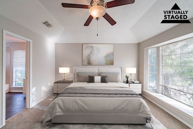 1502 Stevenage Ln, Channelview, TX 77530 - bedroom featuring carpet flooring, vaulted ceiling, baseboards, and a ceiling fan
