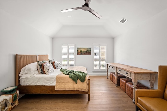 2421 Potomac Dr Unit C, Houston, TX 77057 - bedroom featuring wood finished floors, ceiling fan, and vaulted ceiling