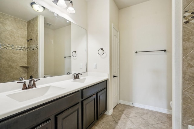3115 Hillside Landing Trl, Katy, TX 77494 - full bathroom featuring toilet, tile patterned floors, double vanity, and tiled shower