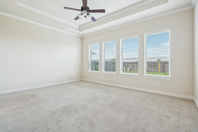3115 Hillside Landing Trl, Katy, TX 77494 - unfurnished room with a raised ceiling, crown molding, light colored carpet, ceiling fan, and baseboards