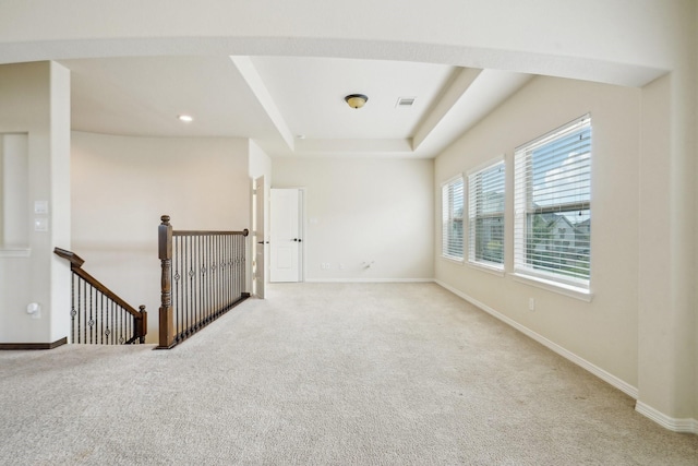 3115 Hillside Landing Trl, Katy, TX 77494 - carpeted empty room featuring baseboards and a raised ceiling