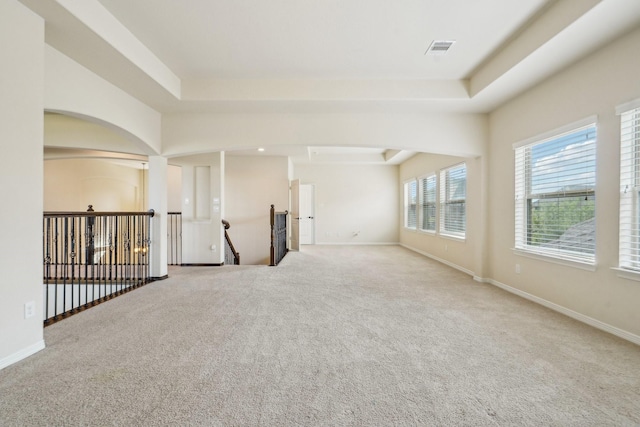 3115 Hillside Landing Trl, Katy, TX 77494 - carpeted spare room with a raised ceiling, baseboards, and arched walkways