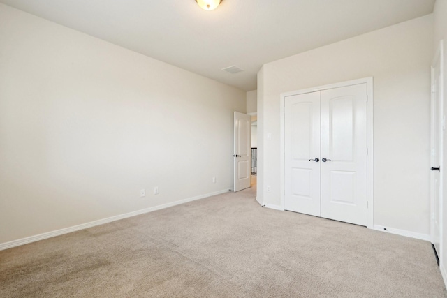 3115 Hillside Landing Trl, Katy, TX 77494 - unfurnished bedroom with light colored carpet, baseboards, and a closet