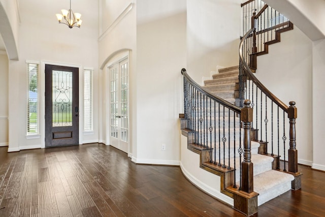 3115 Hillside Landing Trl, Katy, TX 77494 - entrance foyer featuring a towering ceiling, a chandelier, wood-type flooring, baseboards, and stairway