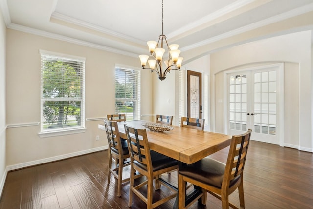 3115 Hillside Landing Trl, Katy, TX 77494 - dining room featuring french doors, a chandelier, dark wood-style floors, a tray ceiling, and baseboards