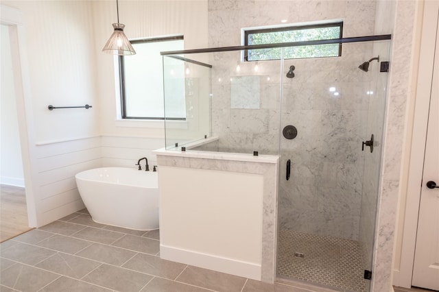 21332 Monarch Dr, Montgomery, TX 77316 - full bathroom with a shower stall, a freestanding tub, and tile patterned floors