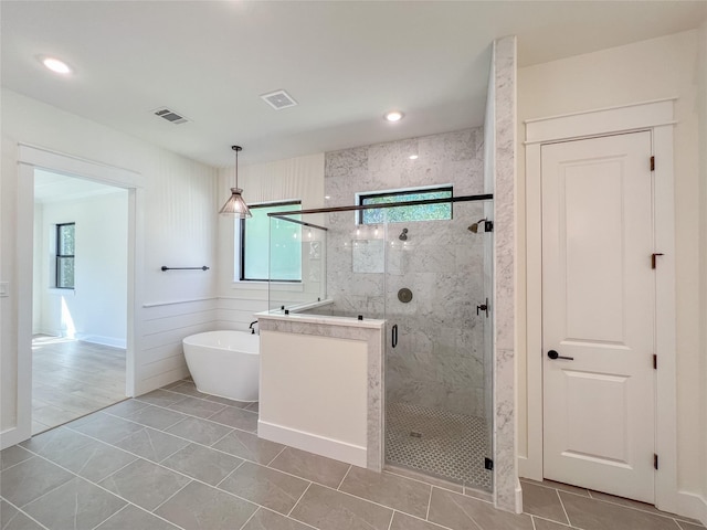 21332 Monarch Dr, Montgomery, TX 77316 - full bathroom with plenty of natural light, a marble finish shower, a freestanding tub, and recessed lighting