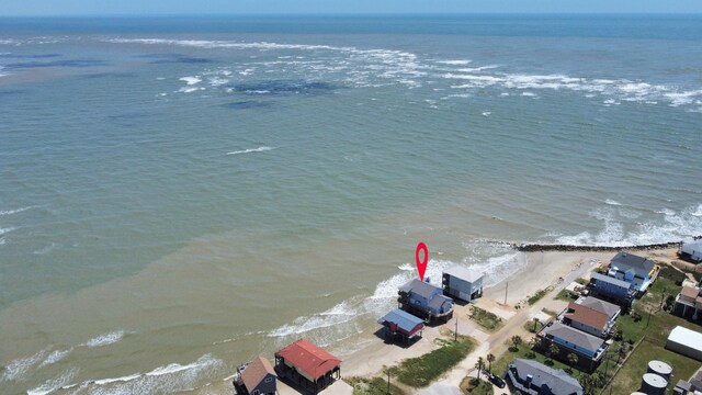 13134 Gulf Beach Dr, Freeport, TX 77541 - aerial view of waterfront with a beach