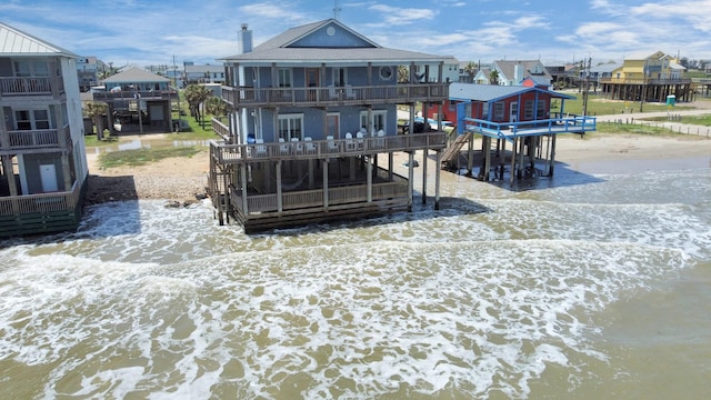 13134 Gulf Beach Dr, Freeport, TX 77541 - back of property with stairway and a deck with water view