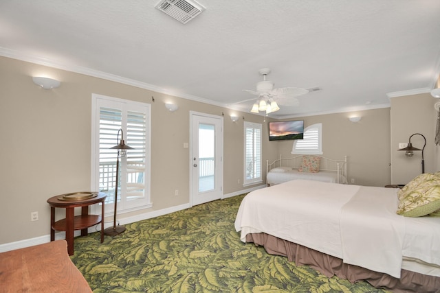 13134 Gulf Beach Dr, Freeport, TX 77541 - bedroom featuring ornamental molding, multiple windows, access to outside, carpet floors, and baseboards