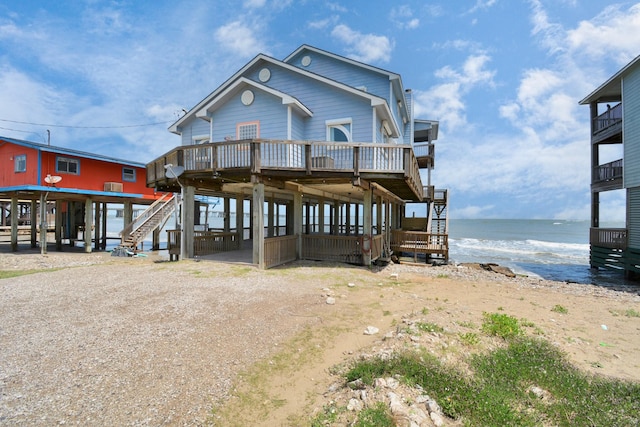 13134 Gulf Beach Dr, Freeport, TX 77541 - coastal inspired home with stairway and a deck with water view