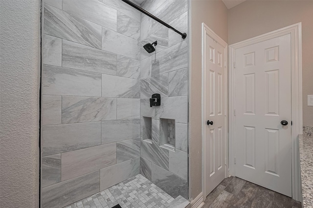 3331 Bridgette Ln, Baytown, TX 77523 - full bathroom featuring a shower stall and wood finished floors
