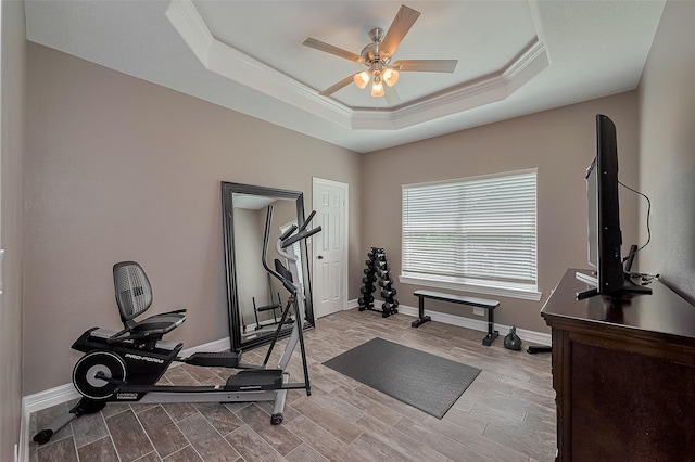 3331 Bridgette Ln, Baytown, TX 77523 - workout room featuring a ceiling fan, a tray ceiling, ornamental molding, baseboards, and wood finished floors