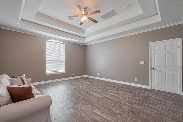 3331 Bridgette Ln, Baytown, TX 77523 - unfurnished room with a tray ceiling, ceiling fan, dark wood finished floors, ornamental molding, and baseboards
