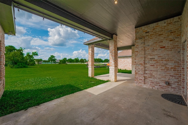 3331 Bridgette Ln, Baytown, TX 77523 - view of grassy yard with a patio area