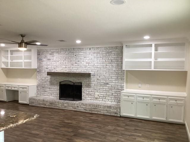 15311 Empanada Dr, Houston, TX 77083 - unfurnished living room with dark wood-style floors, a fireplace, ceiling fan, and recessed lighting