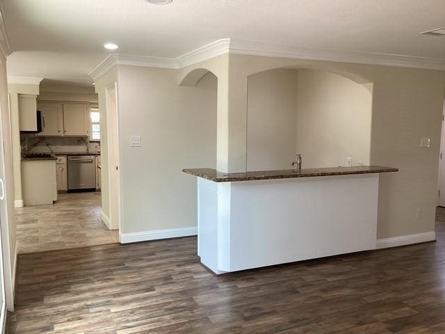 15311 Empanada Dr, Houston, TX 77083 - kitchen with dishwasher, ornamental molding, dark wood-style flooring, baseboards, and a peninsula