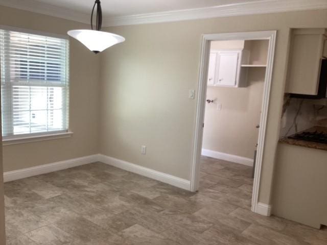 15311 Empanada Dr, Houston, TX 77083 - unfurnished dining area with ornamental molding, baseboards, and light flooring
