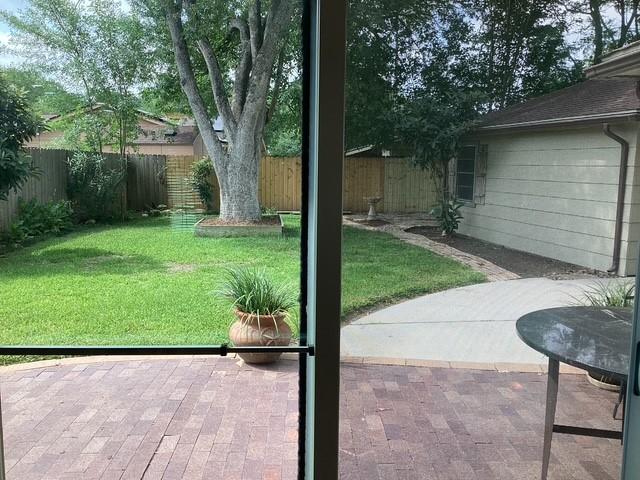 15311 Empanada Dr, Houston, TX 77083 - view of yard featuring a patio