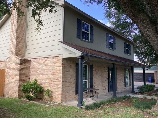 15311 Empanada Dr, Houston, TX 77083 - view of front of property featuring brick siding and a porch