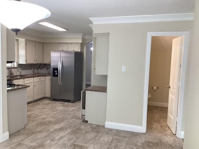 15311 Empanada Dr, Houston, TX 77083 - kitchen featuring stainless steel fridge, a sink, ornamental molding, and baseboards