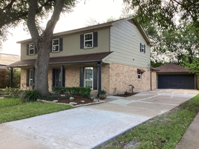 15311 Empanada Dr, Houston, TX 77083 - traditional-style house with an outbuilding, brick siding, and a garage