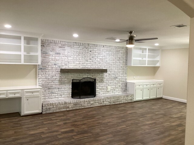 15311 Empanada Dr, Houston, TX 77083 - unfurnished living room with dark wood-type flooring, ceiling fan, a fireplace, recessed lighting, and crown molding