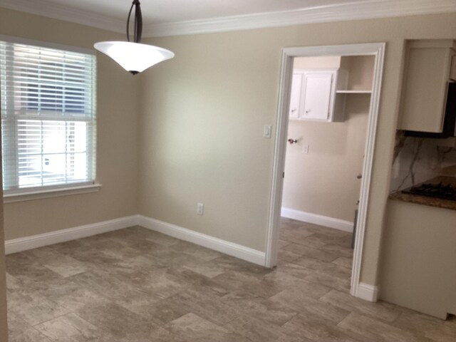 15311 Empanada Dr, Houston, TX 77083 - unfurnished dining area with ornamental molding and baseboards