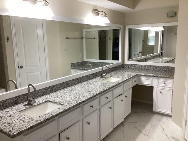 15311 Empanada Dr, Houston, TX 77083 - full bathroom featuring marble finish flooring and double vanity