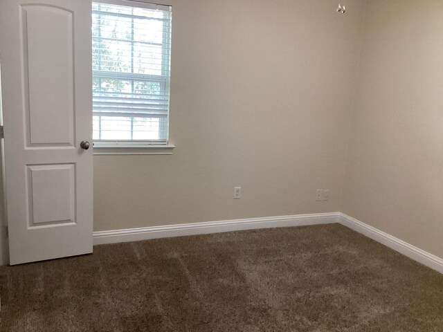 15311 Empanada Dr, Houston, TX 77083 - carpeted empty room with baseboards