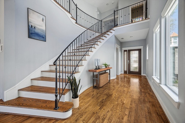 814 Nicholson St, Houston, TX 77007 - foyer entrance with stairs, wood finished floors, a towering ceiling, and plenty of natural light