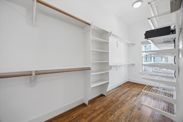 814 Nicholson St, Houston, TX 77007 - walk in closet featuring wood finished floors
