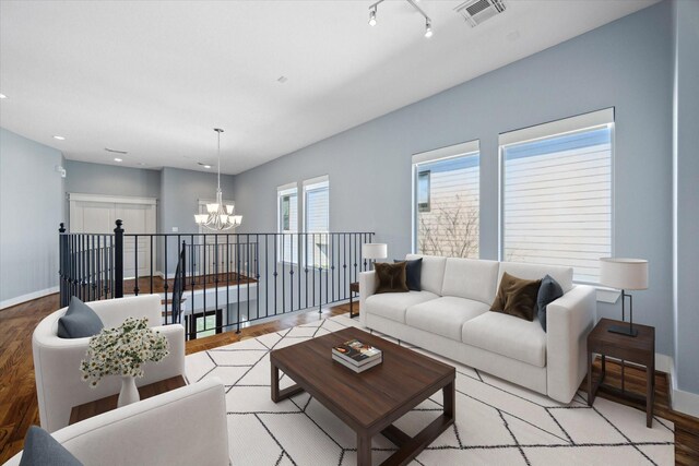 814 Nicholson St, Houston, TX 77007 - living area featuring a chandelier, wood finished floors, baseboards, and recessed lighting