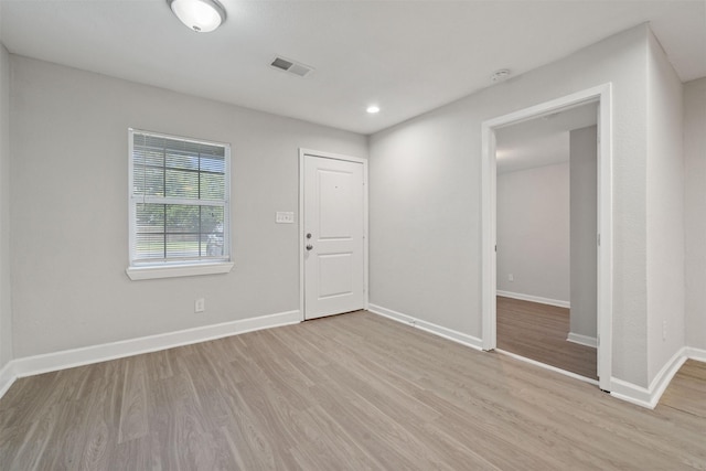 5313 Doolittle Blvd, Houston, TX 77033 - foyer entrance featuring light wood-type flooring and baseboards