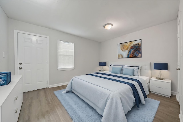 5313 Doolittle Blvd, Houston, TX 77033 - bedroom with light wood-style flooring and baseboards