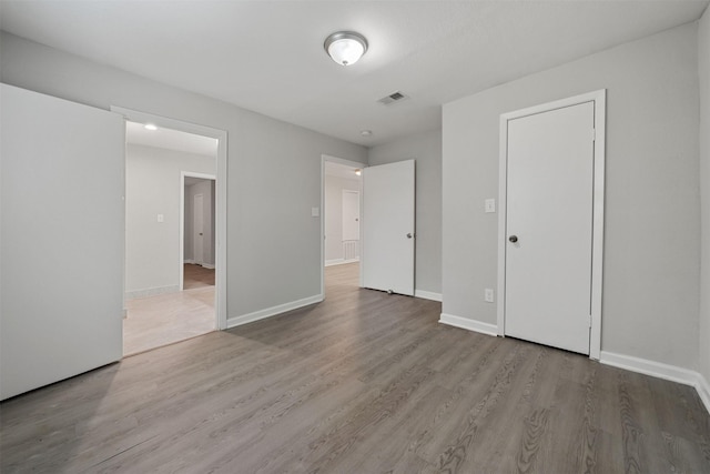5313 Doolittle Blvd, Houston, TX 77033 - unfurnished bedroom featuring wood finished floors and baseboards