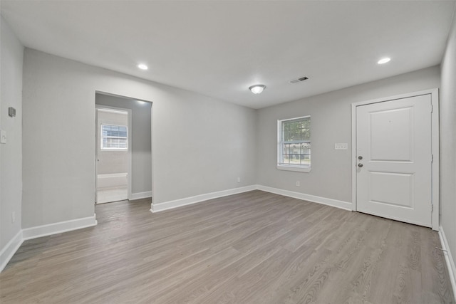 5313 Doolittle Blvd, Houston, TX 77033 - empty room featuring light wood-style floors, baseboards, and recessed lighting