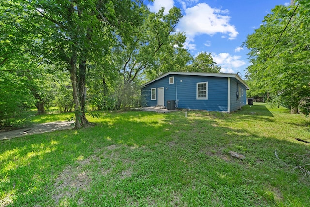 5313 Doolittle Blvd, Houston, TX 77033 - back of property featuring a yard and central air condition unit