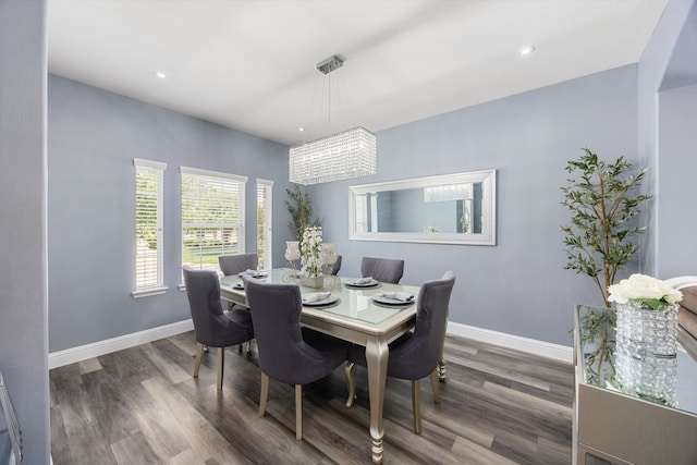 dining space with wood finished floors, baseboards, a chandelier, and recessed lighting