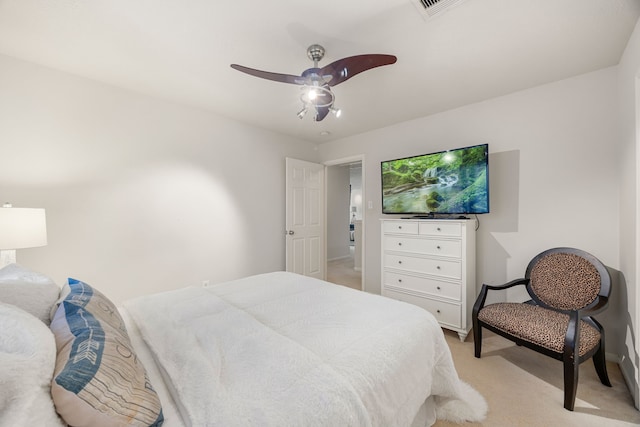 bedroom featuring light carpet, ceiling fan, and baseboards