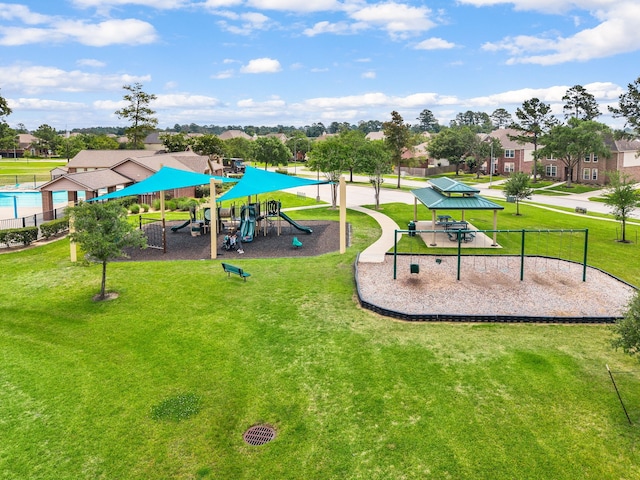 community jungle gym with a lawn