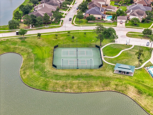 aerial view of residential area with a large body of water
