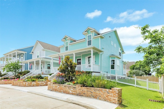 9 Caravelle Ct, Galveston, TX 77554 - victorian home featuring covered porch and board and batten siding
