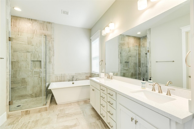 9 Caravelle Ct, Galveston, TX 77554 - full bathroom with a shower stall, a freestanding tub, double vanity, recessed lighting, and marble finish flooring