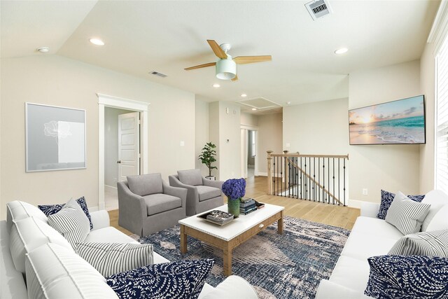 9 Caravelle Ct, Galveston, TX 77554 - living room featuring wood finished floors, ceiling fan, baseboards, recessed lighting, and attic access