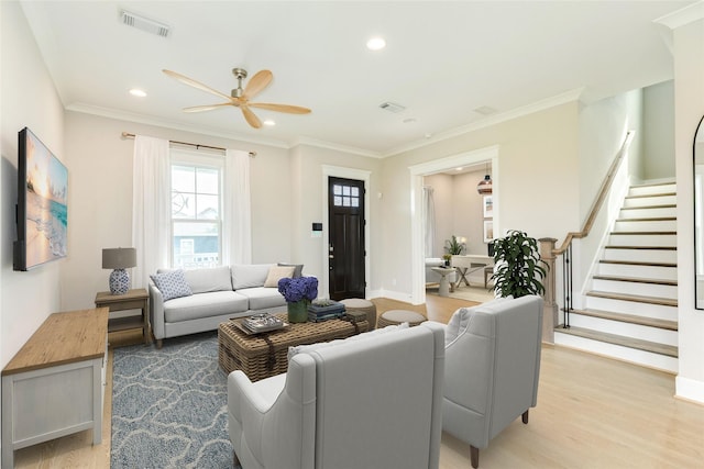 9 Caravelle Ct, Galveston, TX 77554 - living area with a ceiling fan, light wood-style floors, stairs, recessed lighting, and ornamental molding