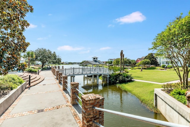 9 Caravelle Ct, Galveston, TX 77554 - dock with a gazebo, a water view, and a lawn